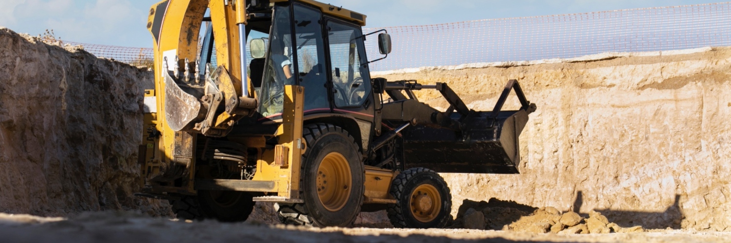 Imagen de referencia de un vehículo de carga pesada en labores de excavación